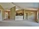 Open living room featuring a kitchen with an island and access to backyard at 13899 Sw 89Th St, Dunnellon, FL 34432