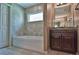 Well-appointed bathroom with a soaking tub, vanity, and tile flooring at 13899 Sw 89Th St, Dunnellon, FL 34432