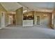 Open living room featuring a kitchen with an island and access to backyard at 13899 Sw 89Th St, Dunnellon, FL 34432