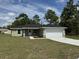 One story home with attached garage, and well manicured lawn at 12 Pecan Run Radl, Ocala, FL 34472