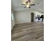 Open concept living area with vinyl flooring and kitchen access at 12 Pecan Run Radl, Ocala, FL 34472
