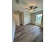 Spacious bedroom with wood-look floors and ceiling fan at 12 Pecan Run Radl, Ocala, FL 34472