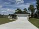 Newly built home with a two-car garage and driveway at 12 Pecan Run Radl, Ocala, FL 34472