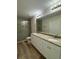 Double vanity bathroom with granite countertops and glass shower at 12 Pecan Run Radl, Ocala, FL 34472