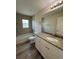 Clean bathroom with granite countertop vanity and bathtub at 12 Pecan Run Radl, Ocala, FL 34472
