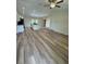 Open concept living room and kitchen with vinyl flooring at 12 Pecan Run Radl, Ocala, FL 34472