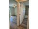 View of bedroom and bathroom with wood-look floors at 12 Pecan Run Radl, Ocala, FL 34472