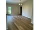 Bright dining room with wood-look floors and access to backyard at 12 Pecan Run Radl, Ocala, FL 34472