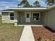 Front porch of a newly built home with landscaping at 12 Pecan Run Radl, Ocala, FL 34472