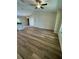 Open concept living room and kitchen with vinyl flooring at 12 Pecan Run Radl, Ocala, FL 34472