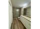 Bathroom boasts double vanity, granite, and a glass shower at 12 Pecan Run Radl, Ocala, FL 34472