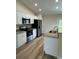Modern kitchen featuring stainless steel appliances and granite countertops at 12 Pecan Run Radl, Ocala, FL 34472