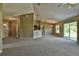 Open living room featuring a kitchen pass-through at 12472 Sw 85Th Pl, Dunnellon, FL 34432