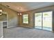 Bright dining room with patio access and carpeting at 12472 Sw 85Th Pl, Dunnellon, FL 34432