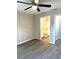 Bright bedroom with ceiling fan and en-suite bathroom at 6044 Nw 65Th Pl, Ocala, FL 34482
