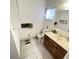 Full bathroom with toilet, sink, and linen closet at 10300 Sw 98Th Ter, Ocala, FL 34481