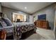 Primary bedroom with a large bed and dresser at 567 Silver Course Run, Ocala, FL 34472