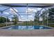 Screened-in pool with clear blue water and a spacious deck at 567 Silver Course Run, Ocala, FL 34472