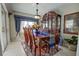 Formal dining room with wood table, chairs, and hutch at 567 Silver Course Run, Ocala, FL 34472