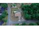 Aerial view of a house with a pool, surrounded by lush greenery at 567 Silver Course Run, Ocala, FL 34472