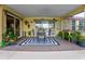 Outdoor patio with dining table, birdcage, and various plants at 567 Silver Course Run, Ocala, FL 34472