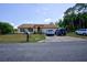 House exterior with driveway and two-car garage at 567 Silver Course Run, Ocala, FL 34472