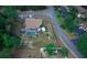Aerial view showing house, pool, and surrounding landscape at 567 Silver Course Run, Ocala, FL 34472