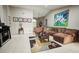 Spacious living room featuring a large sectional sofa and tasteful decor at 567 Silver Course Run, Ocala, FL 34472