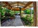 Outdoor kitchen and BBQ area with a covered patio at 567 Silver Course Run, Ocala, FL 34472