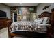 Primary bedroom with a large bed and wall art at 567 Silver Course Run, Ocala, FL 34472