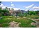 Backyard view showcasing a screened pool and enclosure at 567 Silver Course Run, Ocala, FL 34472