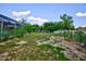 Large backyard with screened pool and garden space at 567 Silver Course Run, Ocala, FL 34472