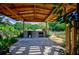 Outdoor kitchen and BBQ area with a covered patio at 567 Silver Course Run, Ocala, FL 34472
