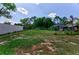 Large backyard with a view of the house and a fenced area at 567 Silver Course Run, Ocala, FL 34472
