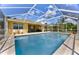 Screened-in pool with clear blue water and a spacious deck at 567 Silver Course Run, Ocala, FL 34472