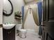 Clean bathroom with a tub shower, toilet, and vanity at 567 Silver Course Run, Ocala, FL 34472