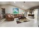 Spacious living room with tile floors and sectional sofa at 567 Silver Course Run, Ocala, FL 34472