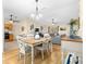 Open dining room with table and chairs, adjacent to kitchen at 7994 Se 174Th Belhaven Loop, The Villages, FL 32162