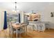 Bright dining area with wood flooring and a chandelier at 7994 Se 174Th Belhaven Loop, The Villages, FL 32162