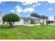 Spacious backyard with screened patio and lush lawn at 7994 Se 174Th Belhaven Loop, The Villages, FL 32162