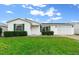 Charming single story home with green landscaping at 7994 Se 174Th Belhaven Loop, The Villages, FL 32162