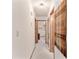 Home hallway with carpet, neutral walls, and wooden doors at 10881 Sw 79Th Ter, Ocala, FL 34476
