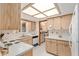 Efficient kitchen with wood cabinets and recessed lighting at 10881 Sw 79Th Ter, Ocala, FL 34476