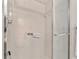 Walk-in shower with grab bars and tiled walls at 10881 Sw 79Th Ter, Ocala, FL 34476