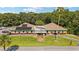 Community clubhouse with solar panels and landscaping at 10881 Sw 79Th Ter, Ocala, FL 34476