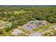 Aerial view of community tennis courts, pool, and clubhouse at 10881 Sw 79Th Ter, Ocala, FL 34476