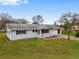 Ranch style home with front porch and yard at 10881 Sw 79Th Ter, Ocala, FL 34476