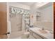 Clean bathroom with a tub shower, vanity, and toilet at 10881 Sw 79Th Ter, Ocala, FL 34476