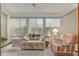 Relaxing sunroom with comfortable seating and natural light at 10881 Sw 79Th Ter, Ocala, FL 34476