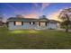 Ranch style home with a covered porch and well-maintained lawn at 10881 Sw 79Th Ter, Ocala, FL 34476